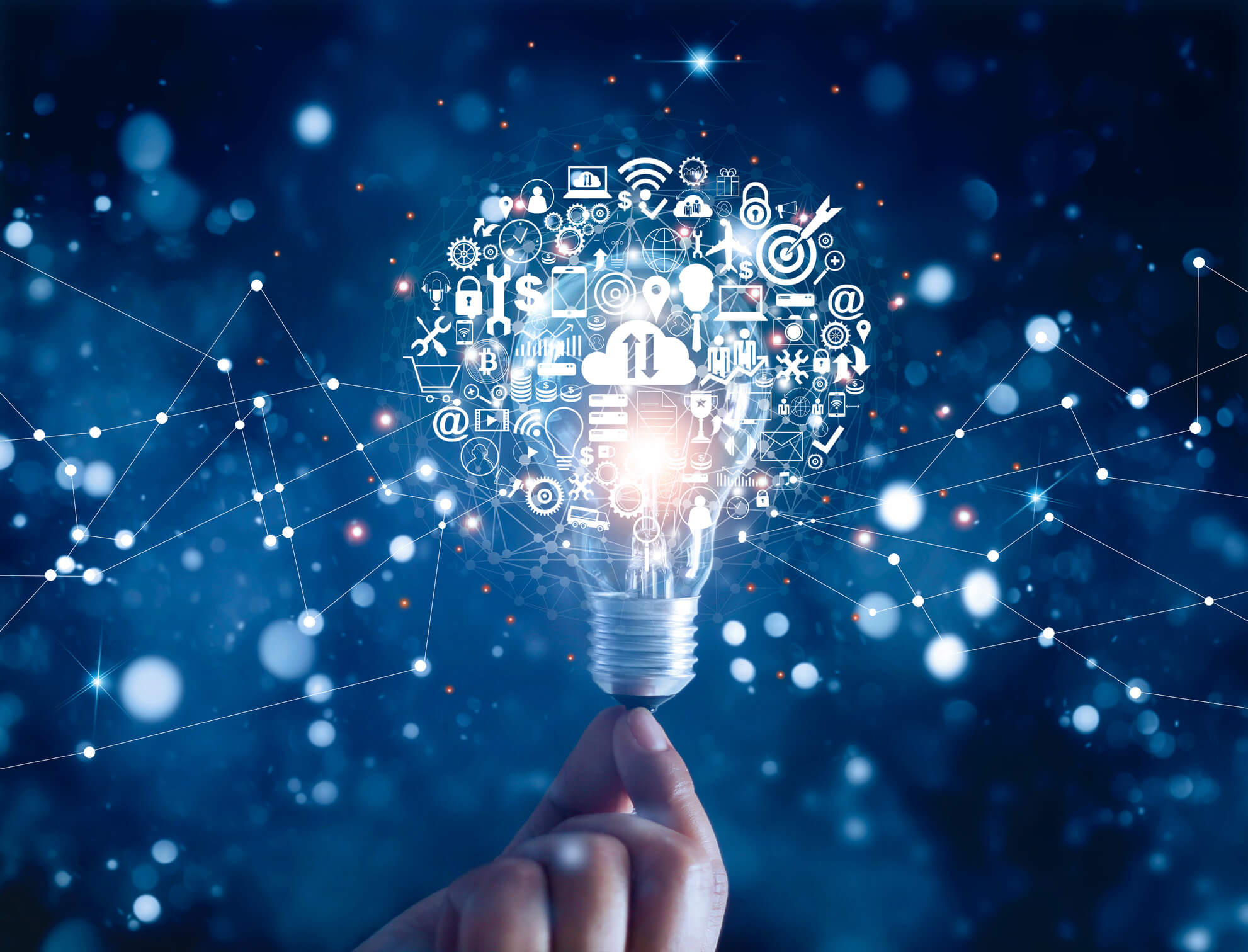 Hand holding light bulb and business digital marketing innovation technology icons on network connection, blue background borrar