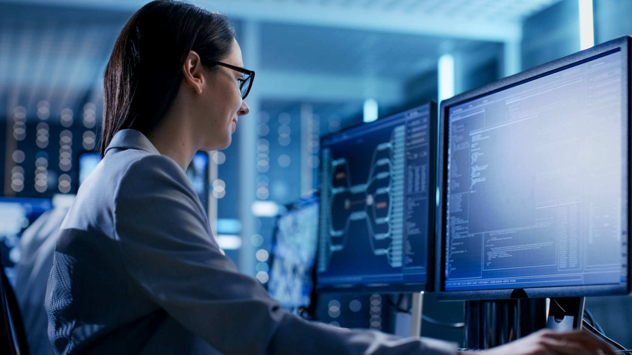 Close-up Shot of Female IT Engineer Working in Monitoring Room. She Works with Multiple Displays. Single Sign-on and Active Directory Integration active directory,single sign on,ad servers,sd wan,ai